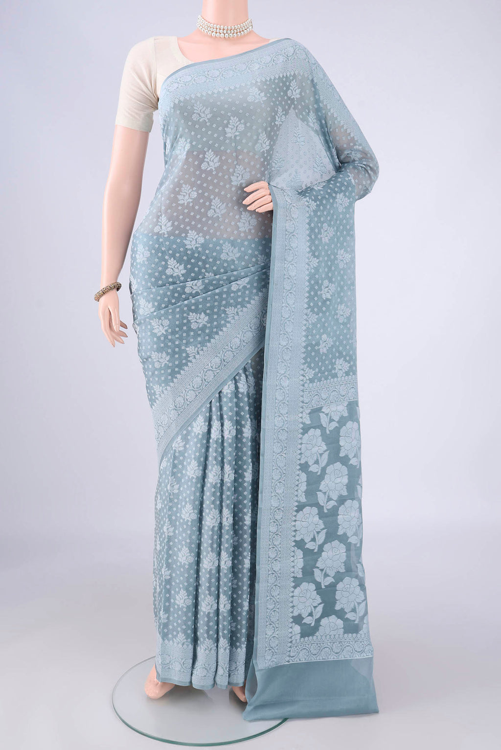 Blue Grey Blended Banarasi Georgette Saree with Thread Butta on the body and Thread Border.  displayed on a mannequin