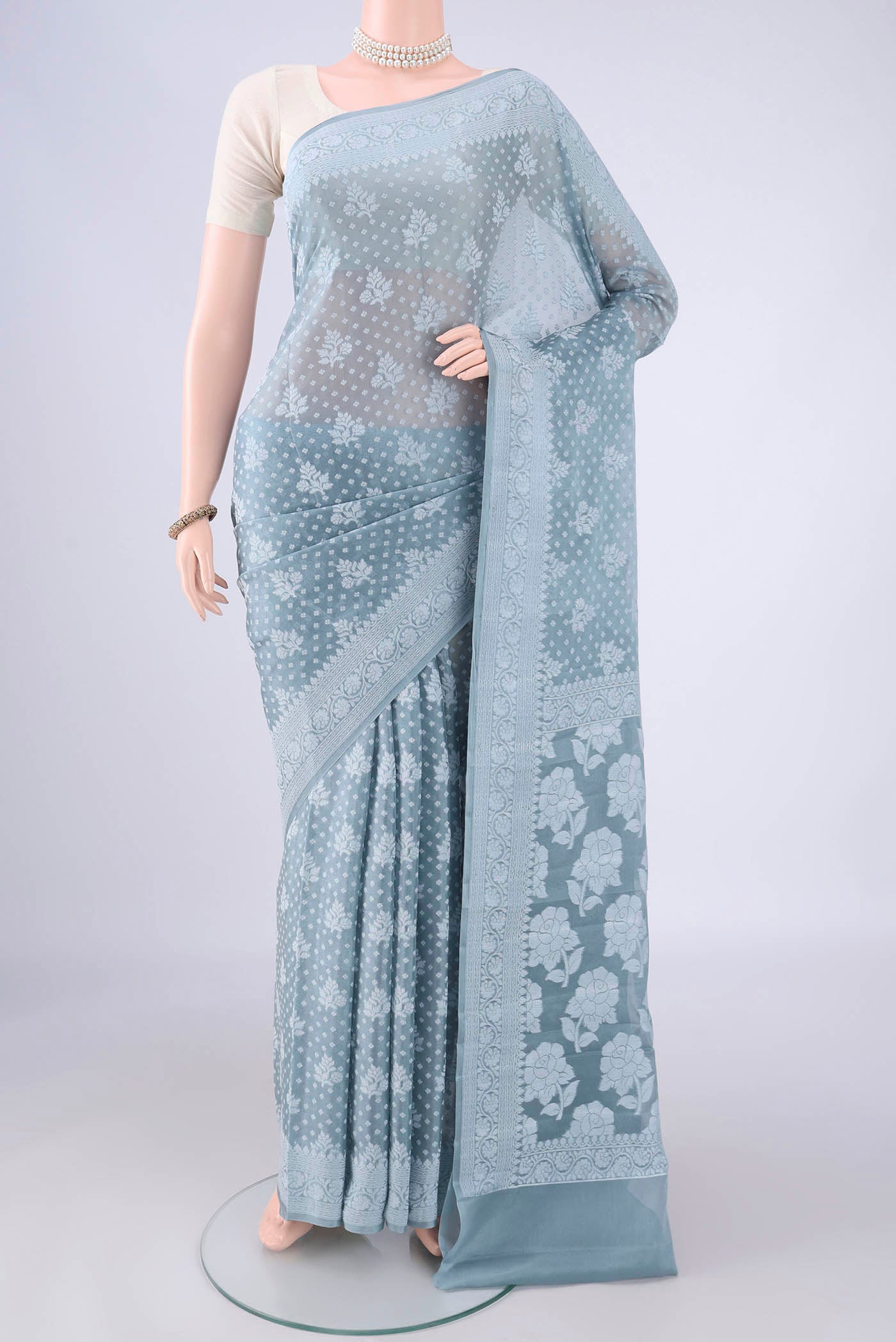 Blue Grey Blended Banarasi Georgette Saree with Thread Butta on the body and Thread Border.  displayed on a mannequin