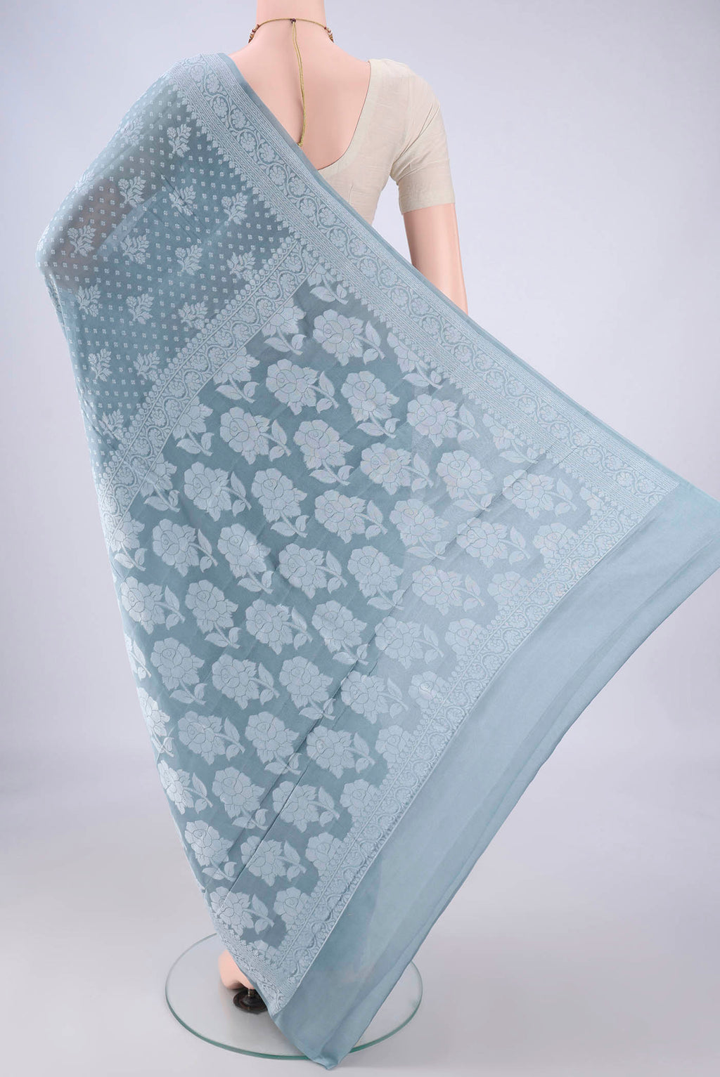 Flat view of Blue Grey Blended Banarasi Georgette Saree with Thread Butta on the body and Thread Border. 