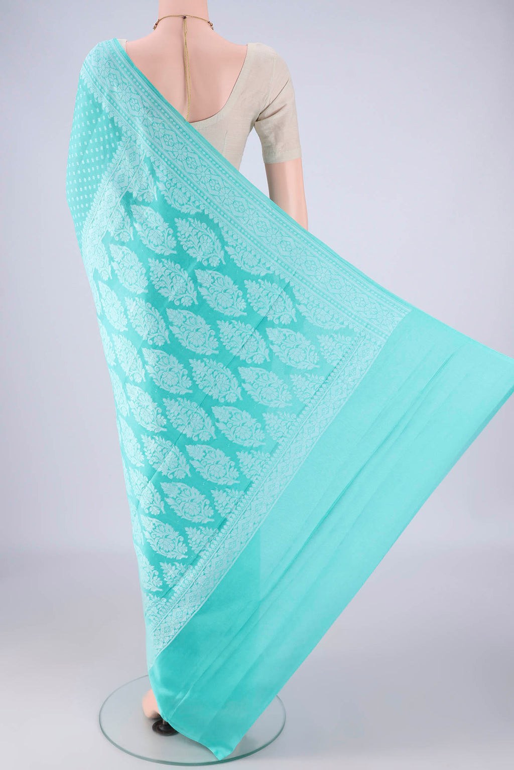Flat view of Sky Blue Blended Banarasi Georgette Saree with Thread Butta on the body and Thread Border. 