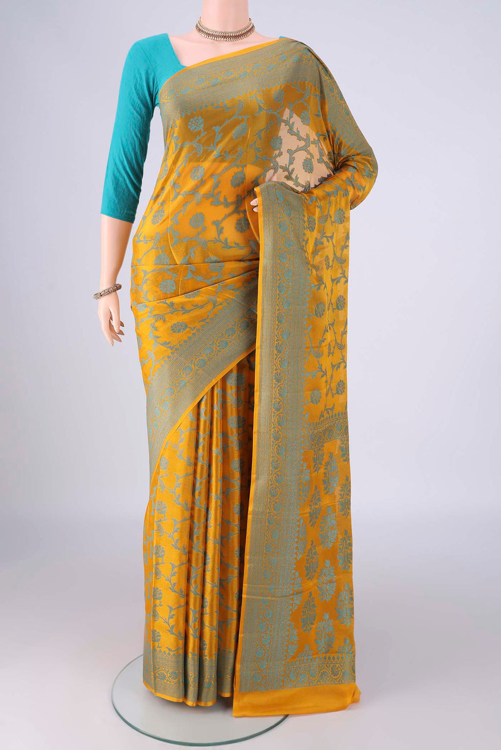 Yellow Blended Banarasi Georgette Saree with Thread Brocade on the body and Thread Border.  displayed on a mannequin