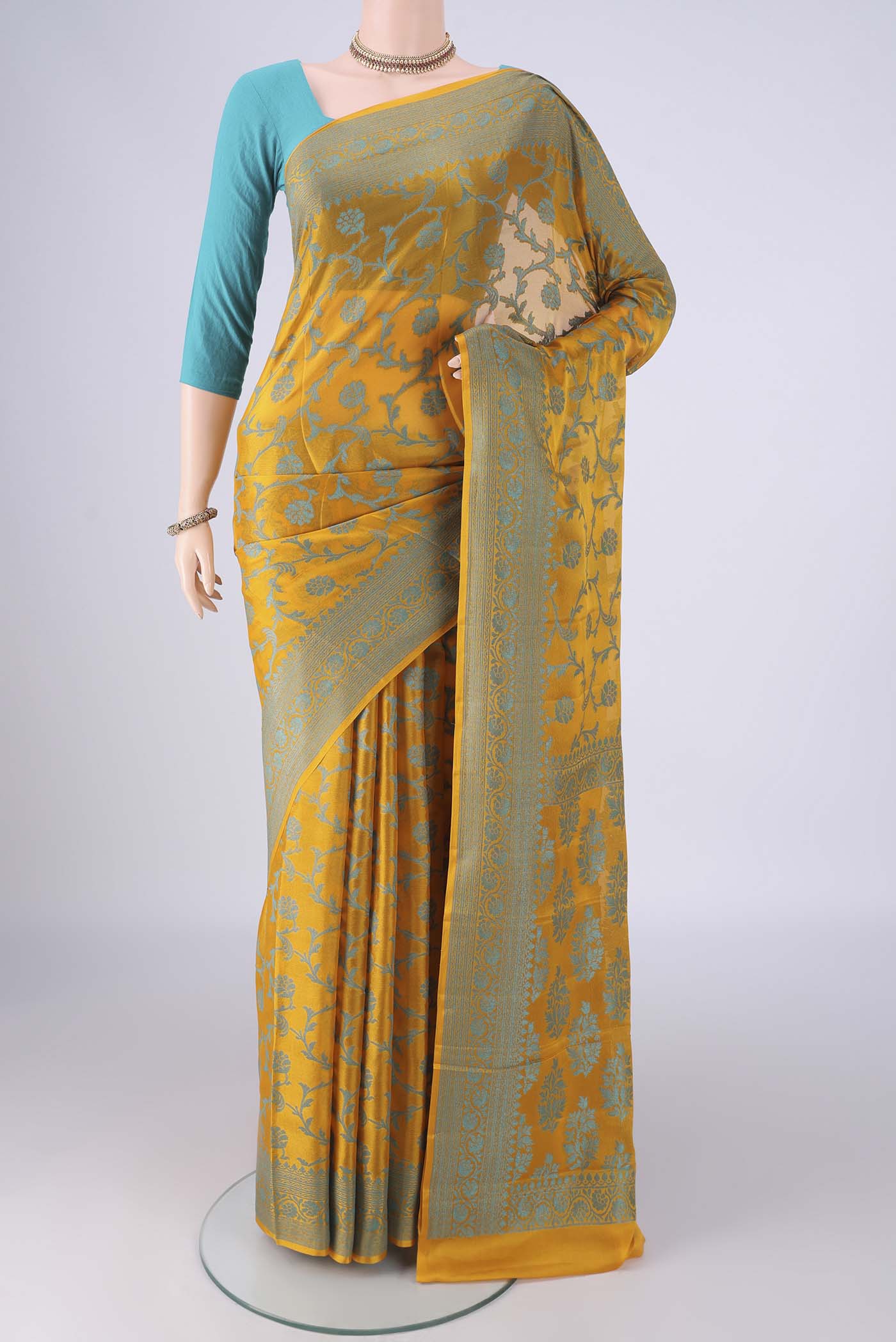Yellow Blended Banarasi Georgette Saree with Thread Brocade on the body and Thread Border.  displayed on a mannequin