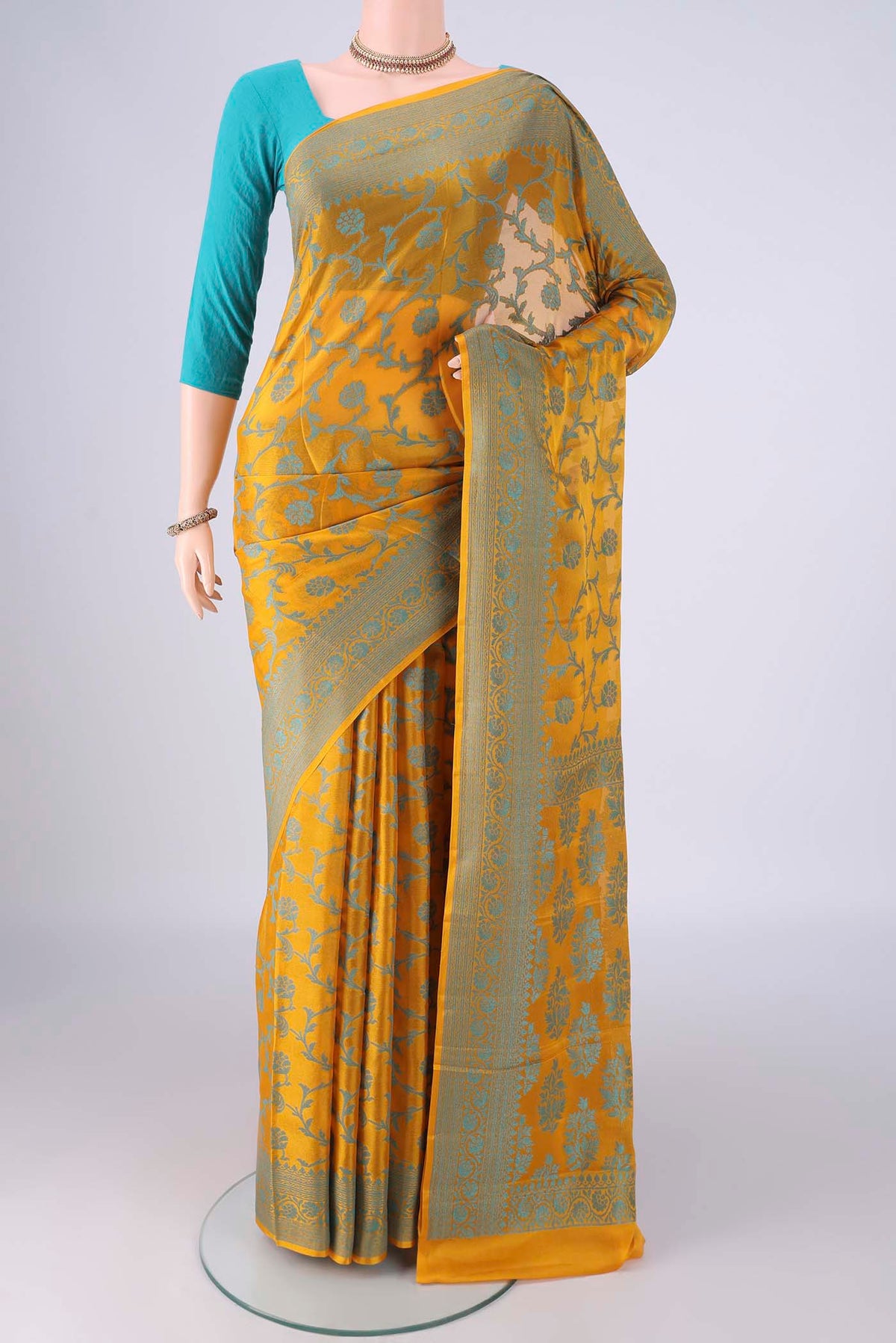Yellow Blended Banarasi Georgette Saree with Thread Brocade on the body and Thread Border.  displayed on a mannequin