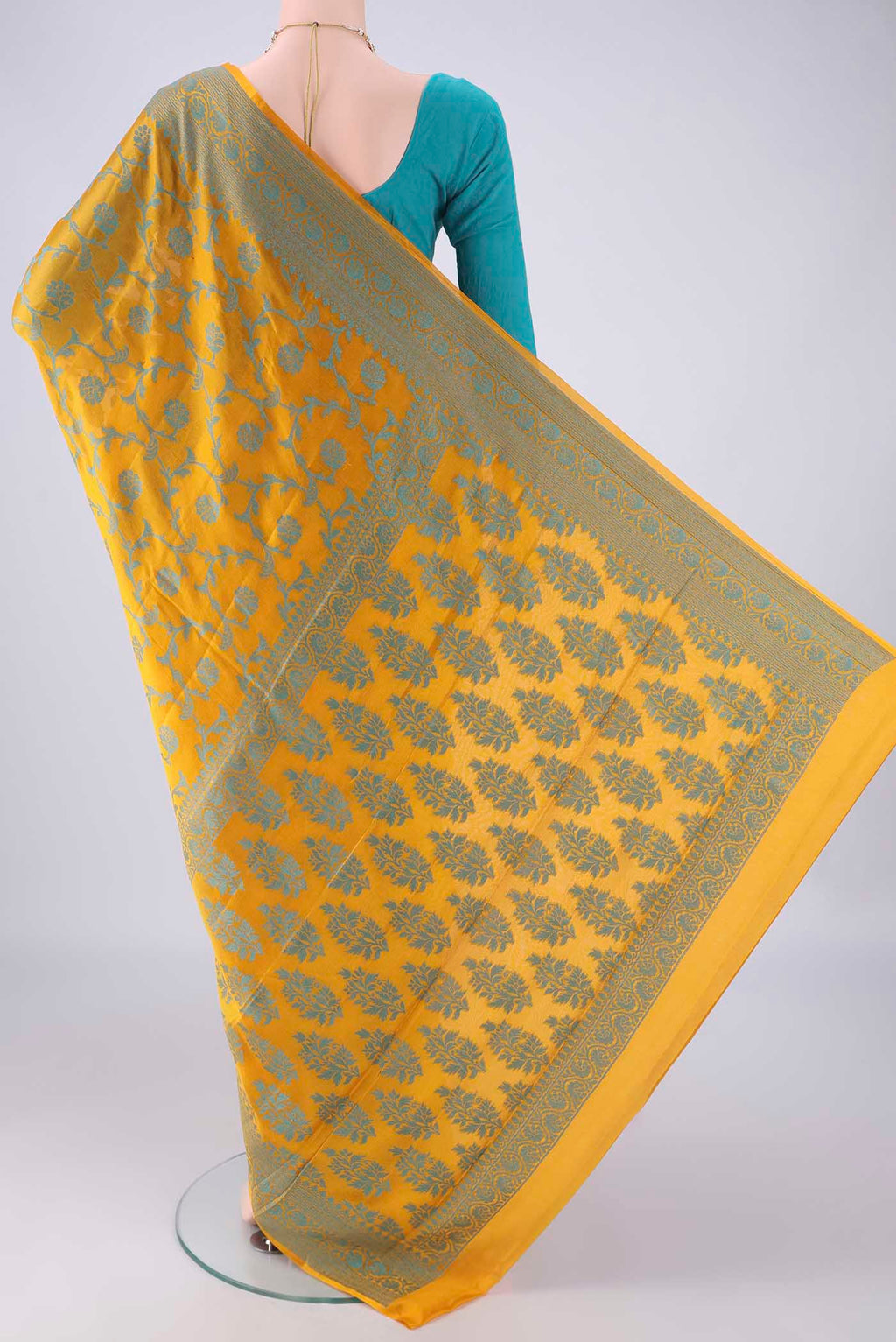 Flat view of Yellow Blended Banarasi Georgette Saree with Thread Brocade on the body and Thread Border. 