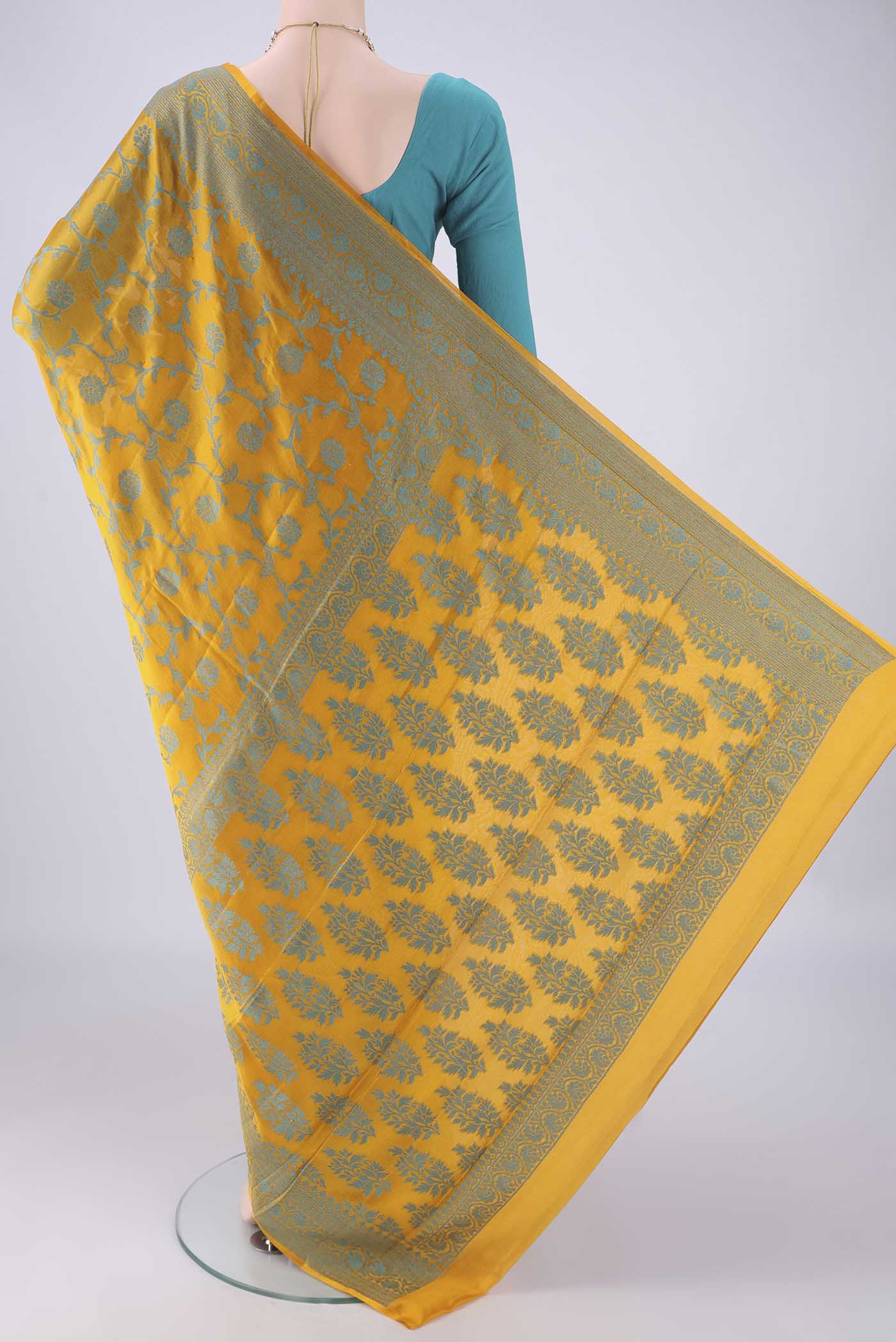 Flat view of Yellow Blended Banarasi Georgette Saree with Thread Brocade on the body and Thread Border. 