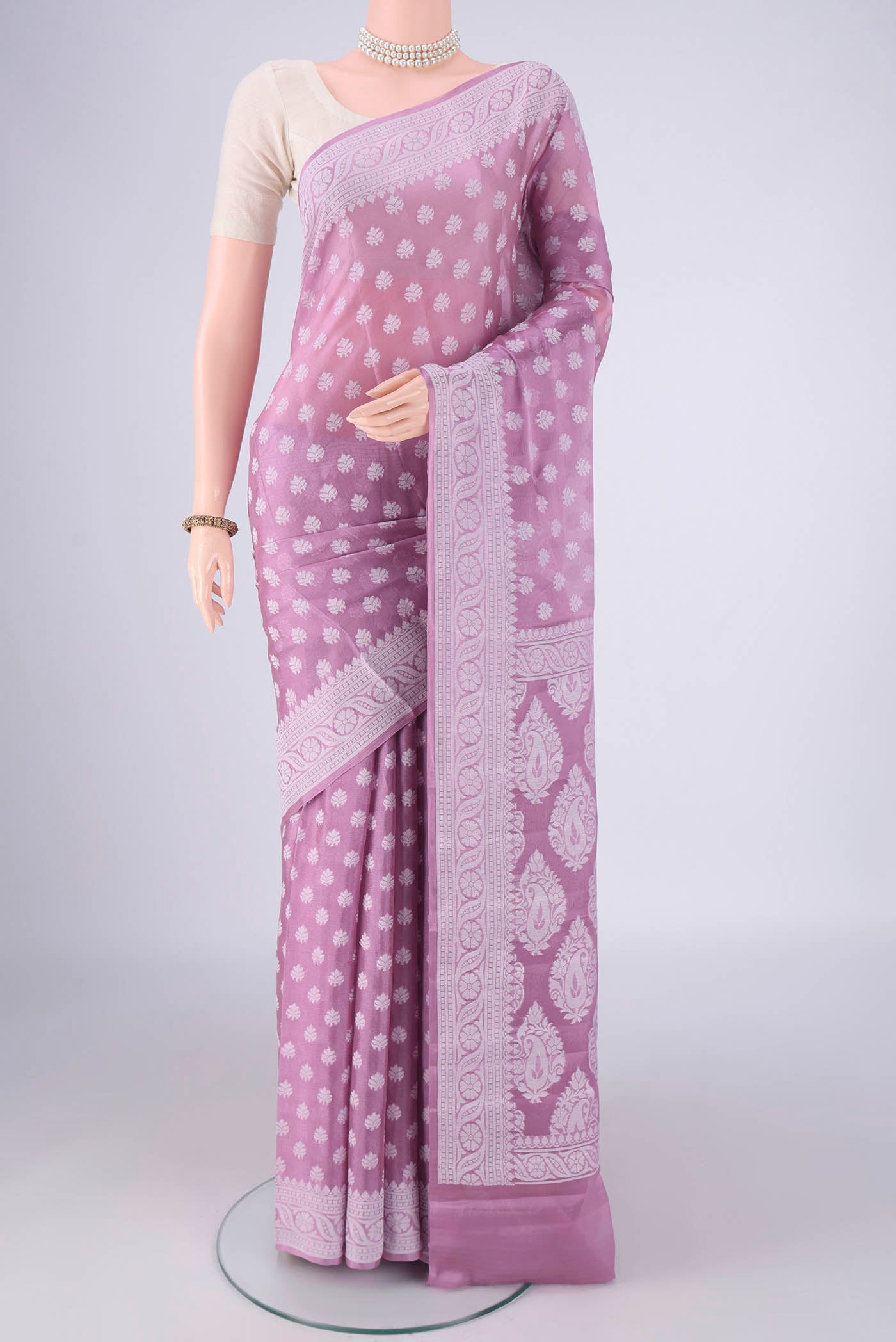 Lavender Blended Banarasi Georgette Saree with Thread Butta on the body and Thread Border.  displayed on a mannequin