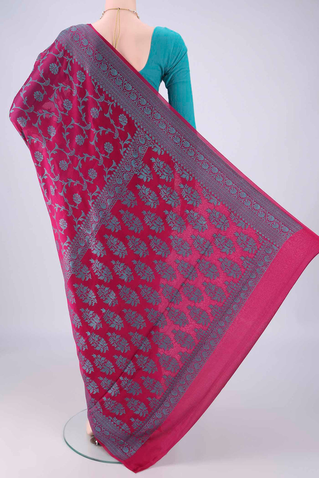 Flat view of Magenta Blended Banarasi Georgette Saree with Thread Brocade on the body and Thread Border. 
