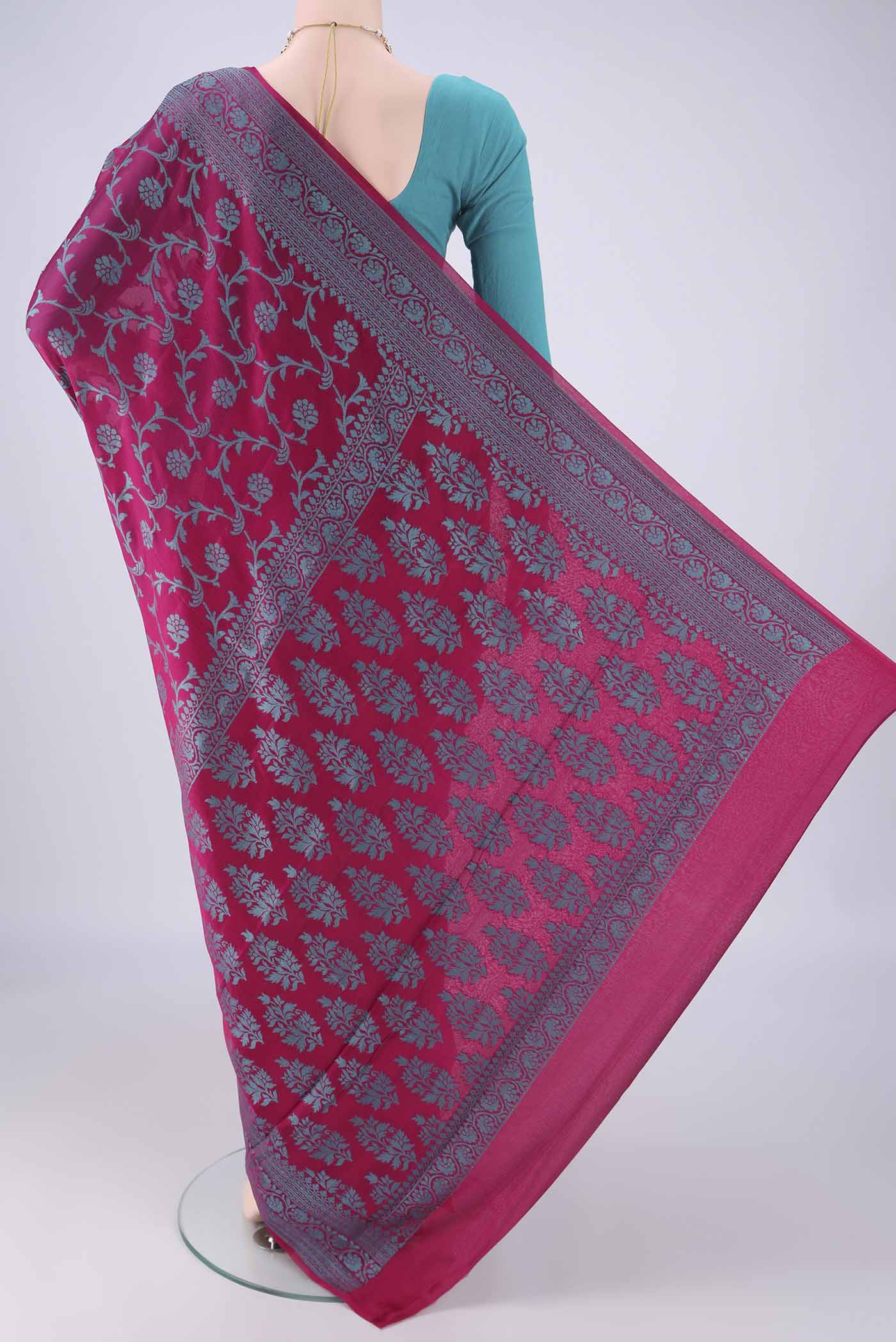 Flat view of Magenta Blended Banarasi Georgette Saree with Thread Brocade on the body and Thread Border. 