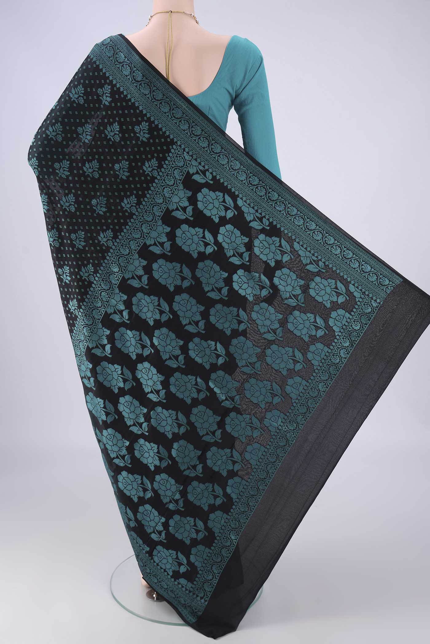 Flat view of Black Blended Banarasi Georgette Saree with Thread Brocade on the body and Thread Border. 