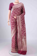 Magenta Banarasi Silk Saree with Zari Brocade on the body and Zari Border.  displayed on a mannequin