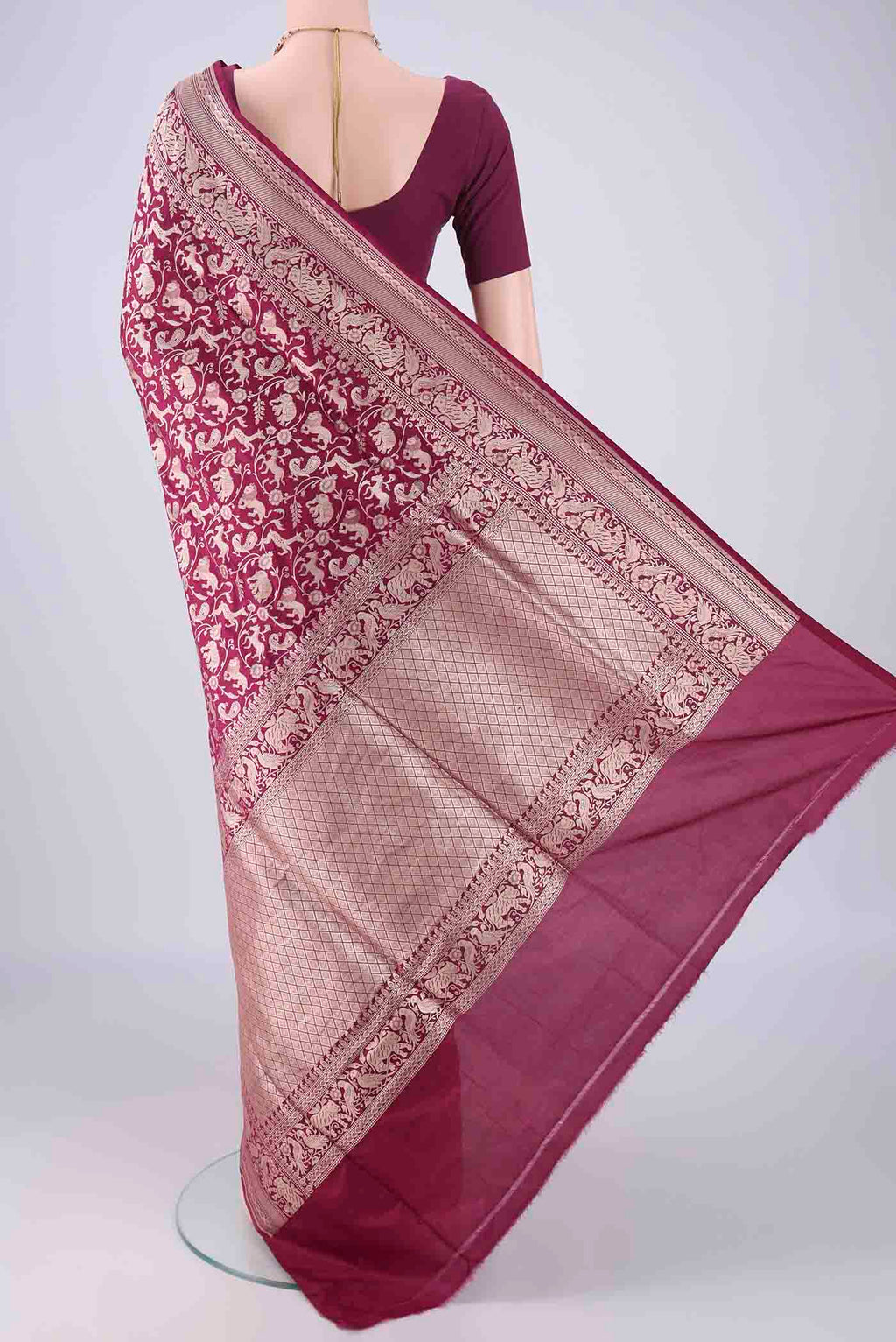 Flat view of Magenta Banarasi Silk Saree with Zari Brocade on the body and Zari Border. 