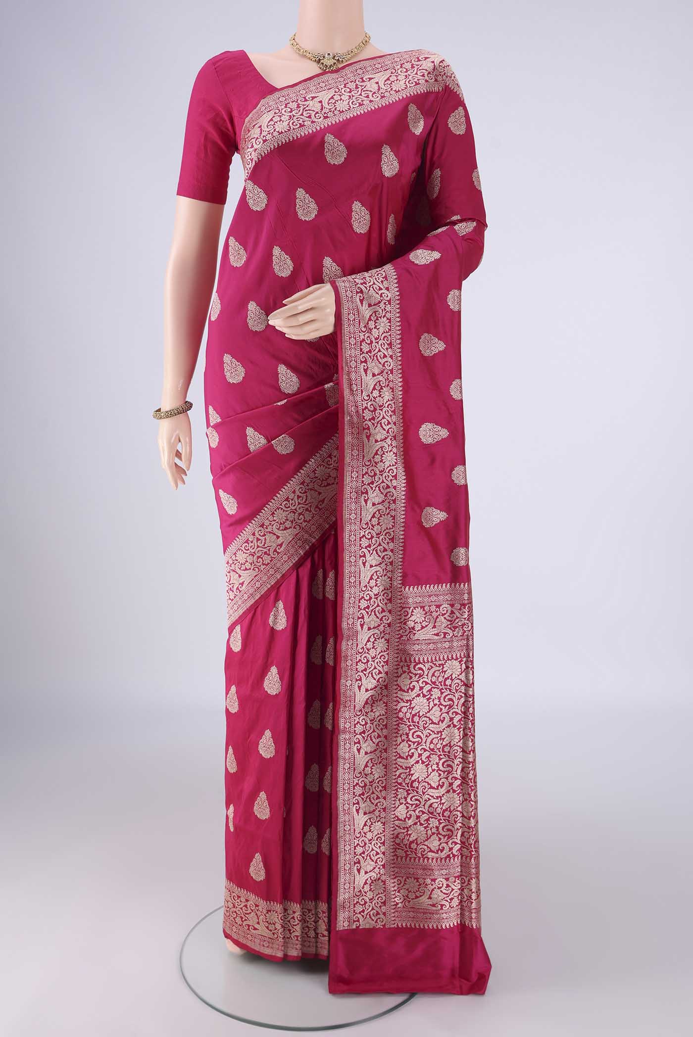 Dark Pink Banarasi Silk Saree with Zari Butta on the body and Zari Border.  displayed on a mannequin