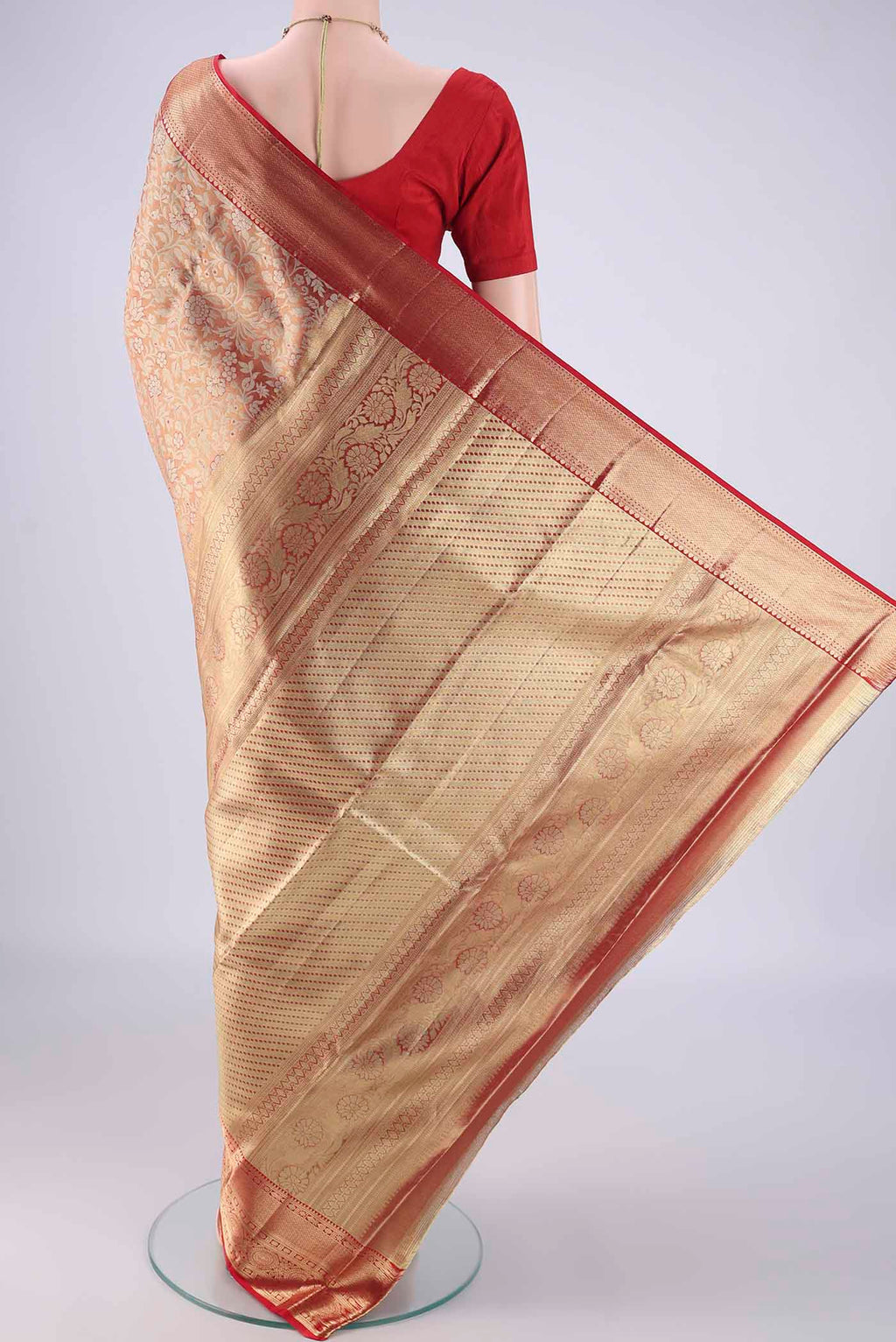 Flat view of Gold with Red Color Kanjivaram Tissue Silk Saree with Zari Brocade on the body and Zari Border. 
