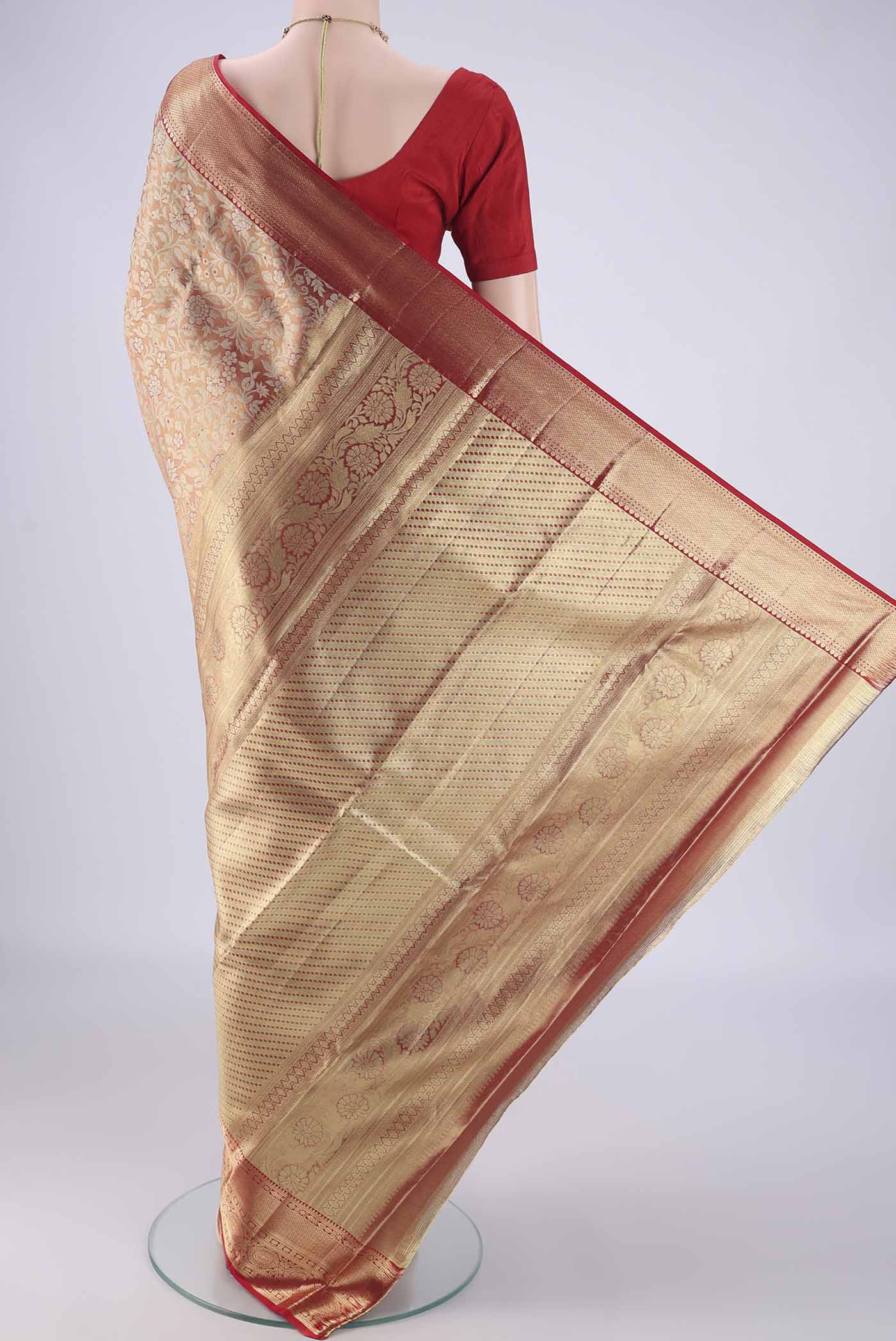 Flat view of Gold with Red Color Kanjivaram Tissue Silk Saree with Zari Brocade on the body and Zari Border. 