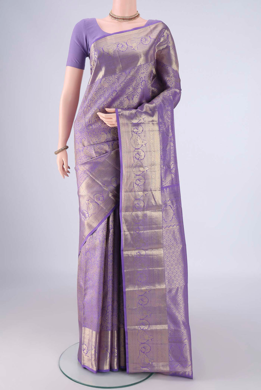 Lavender Dual Tone Kanchipuram Tissue Silk Saree with Zari Brocade on the body and Zari Border.  displayed on a mannequin