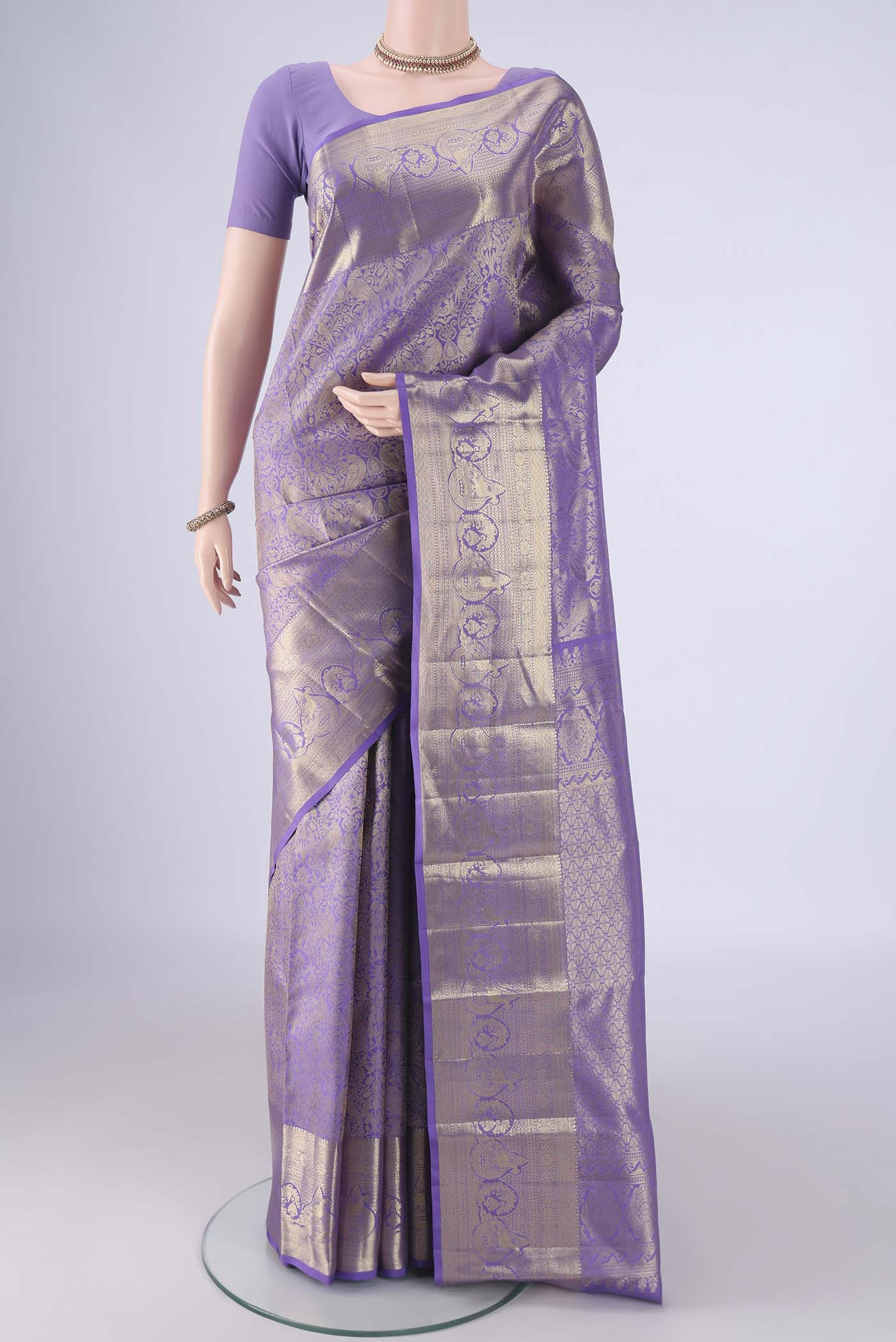 Lavender Dual Tone Kanchipuram Tissue Silk Saree with Zari Brocade on the body and Zari Border.  displayed on a mannequin