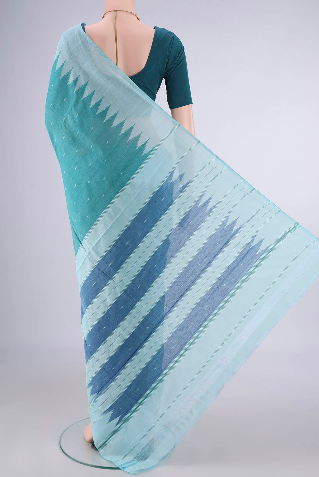 Flat view of Sea Green Pochampally Cotton Saree with Ikat design on the body and Temple Border. 