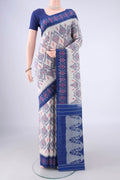 Off White Pochampally Cotton Saree with Ikat design on the body and Ikat Border.  displayed on a mannequin