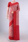 Peach Pochampally Cotton Saree with Ikat design on the body and Ikat Border.  displayed on a mannequin