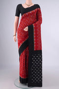 Red Pochampally Cotton Saree with Ikat design on the body and Ikat Border.  displayed on a mannequin