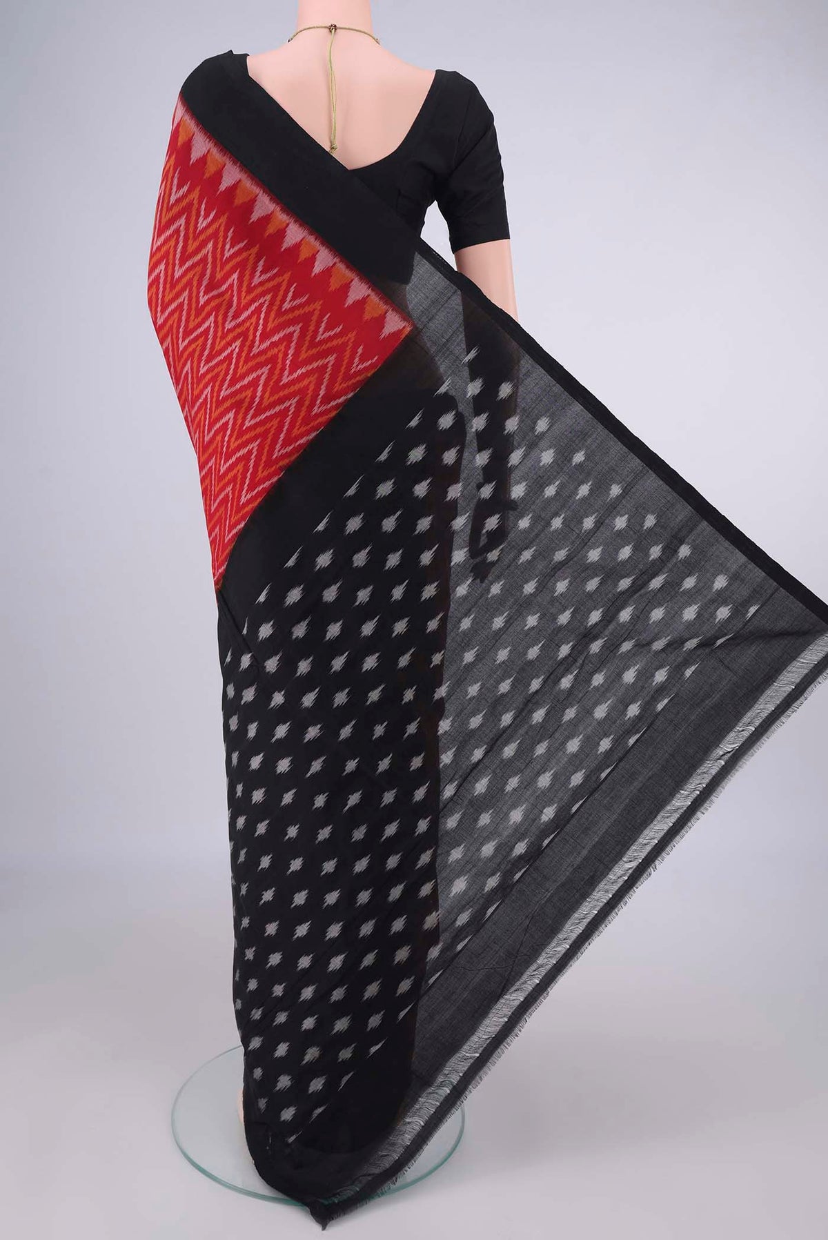 Flat view of Red Pochampally Cotton Saree with Ikat design on the body and Ikat Border. 