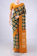 Bottle Green Pochampally Cotton Saree with Ikat design on the body and Plain Border.  displayed on a mannequin