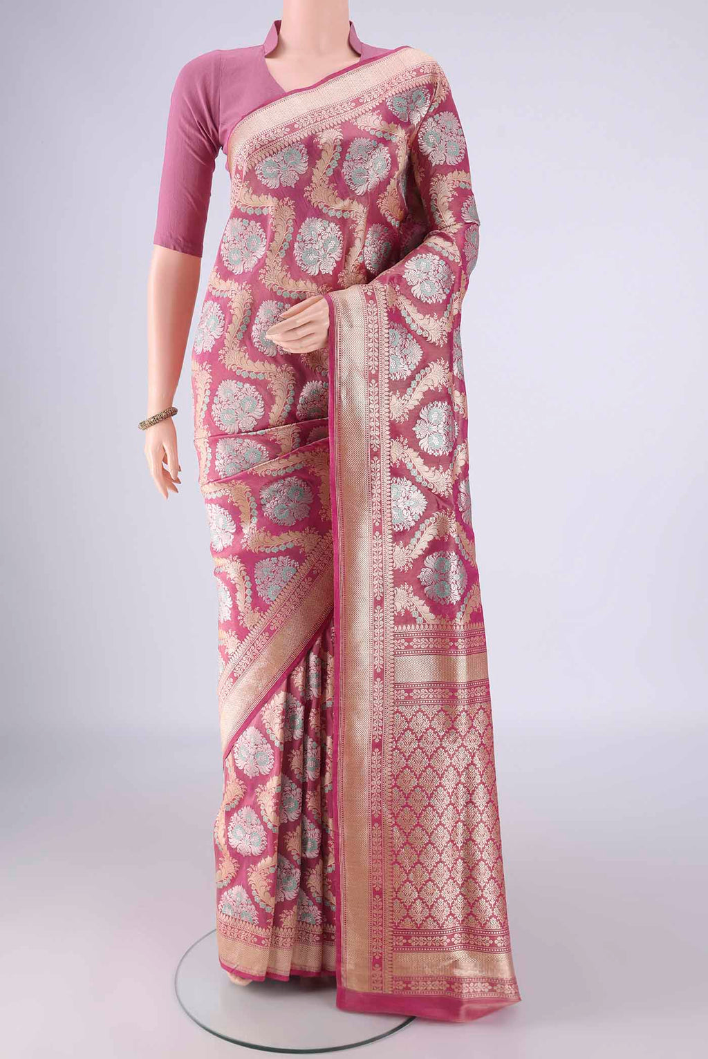 Rani Pink Banarasi Silk Saree with Zari Brocade on the body and Zari Border.  displayed on a mannequin