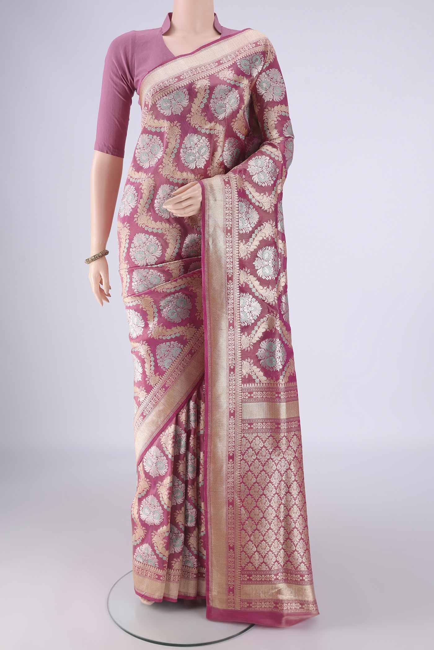Rani Pink Banarasi Silk Saree with Zari Brocade on the body and Zari Border.  displayed on a mannequin