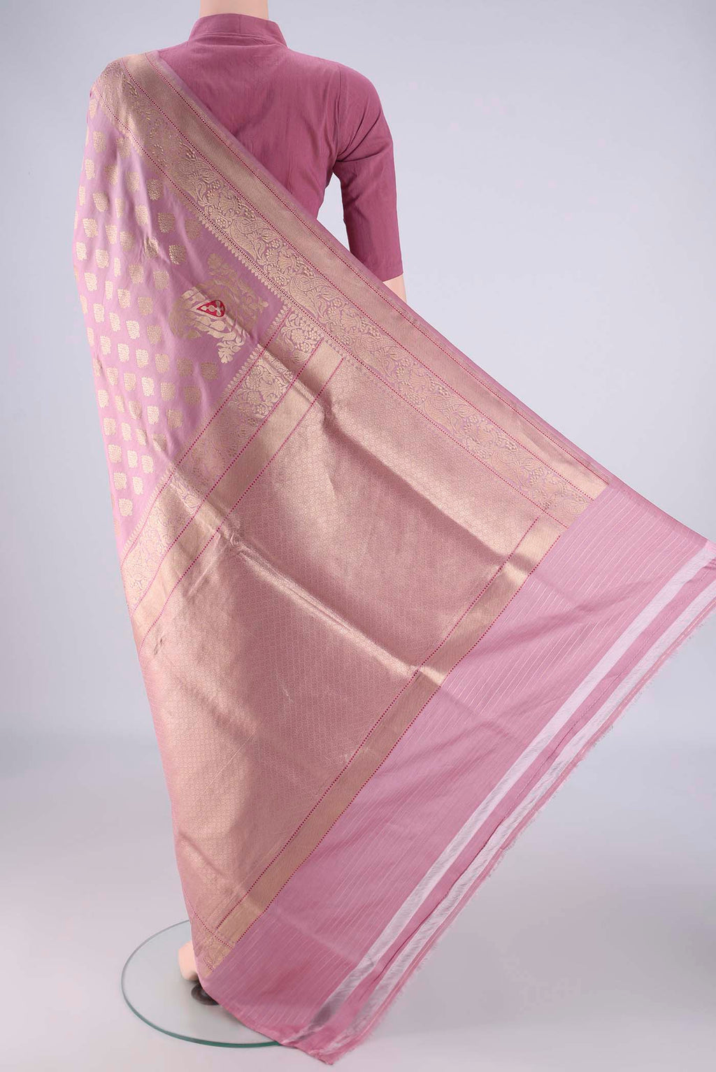Flat view of Rose pink Banarasi Silk Saree with Zari Butta on the body and Zari Border. 