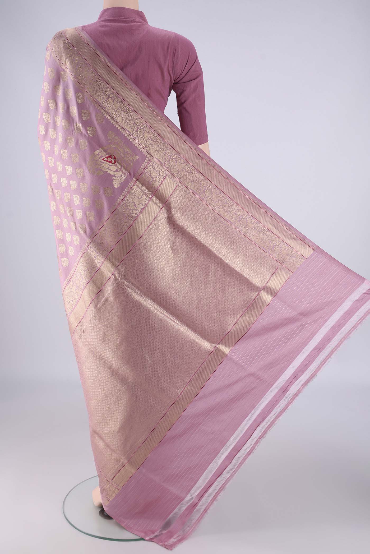 Flat view of Rose pink Banarasi Silk Saree with Zari Butta on the body and Zari Border. 