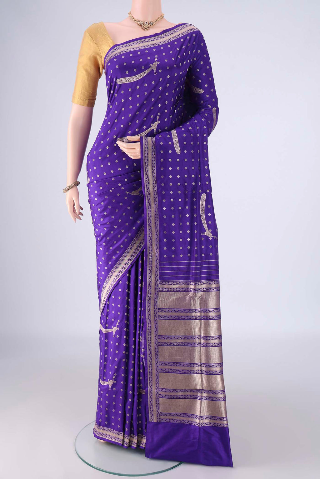 Royal Blue Banarasi Silk Saree with Zari Butta on the body and Zari Border.  displayed on a mannequin