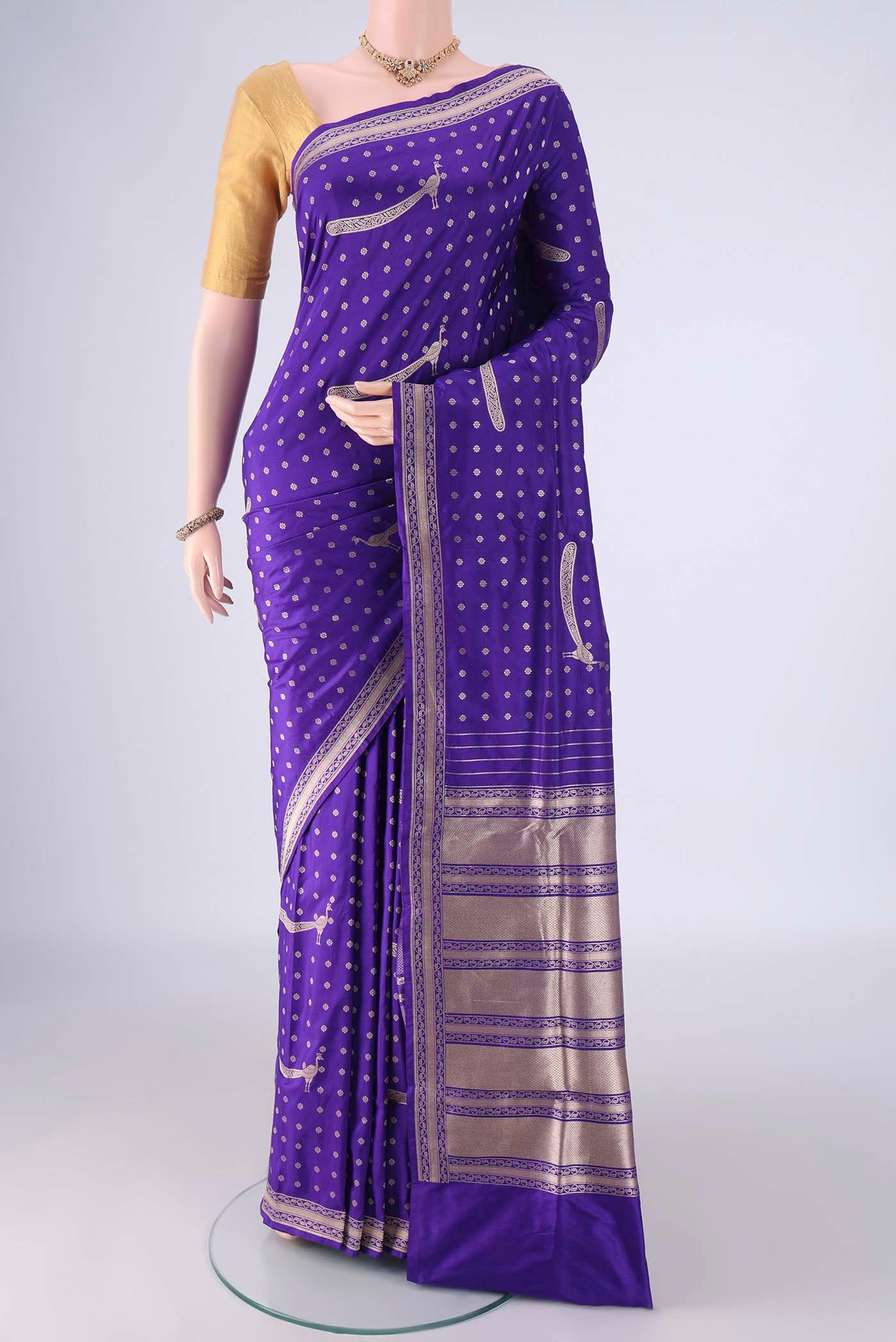 Royal Blue Banarasi Silk Saree with Zari Butta on the body and Zari Border.  displayed on a mannequin