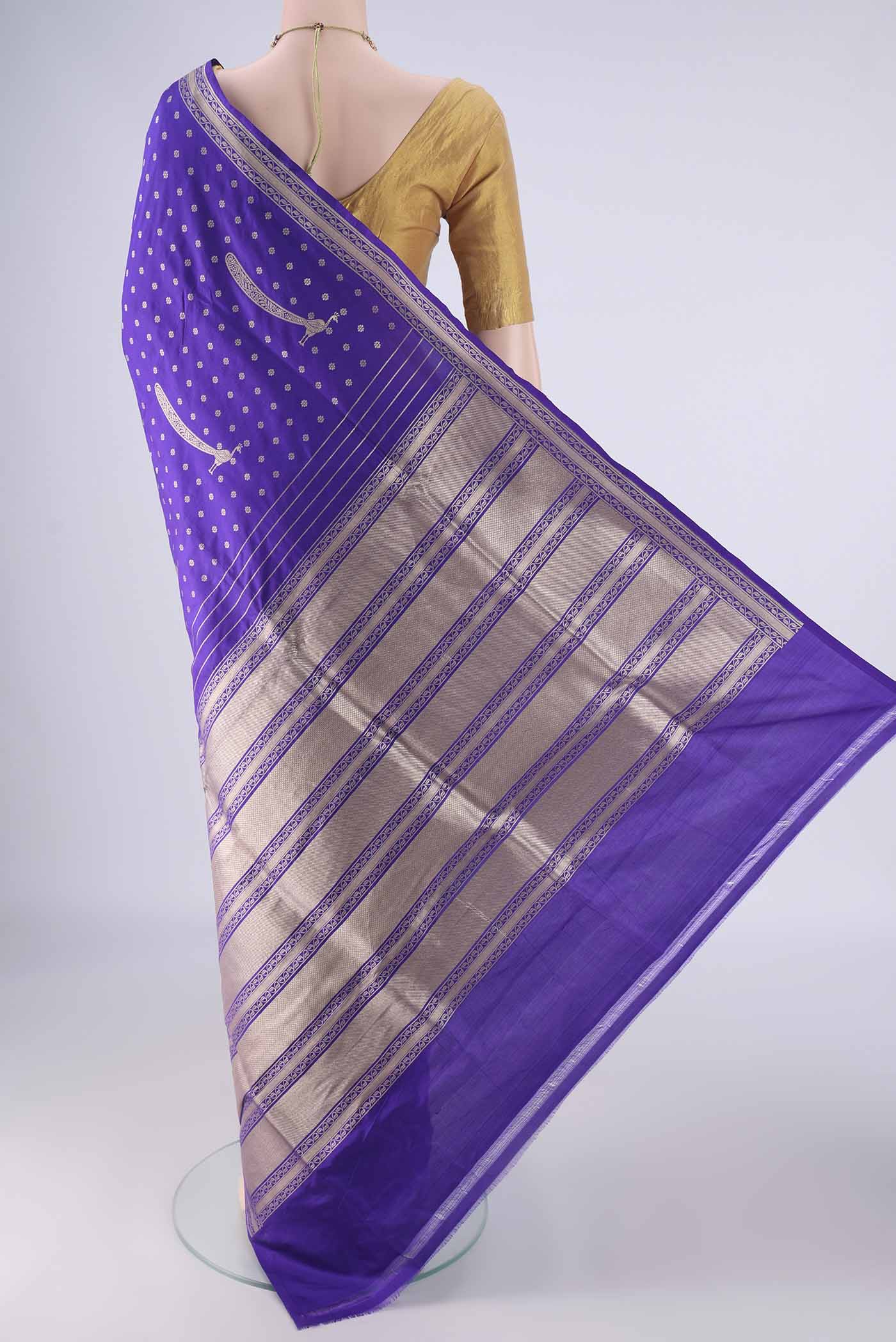 Flat view of Royal Blue Banarasi Silk Saree with Zari Butta on the body and Zari Border. 