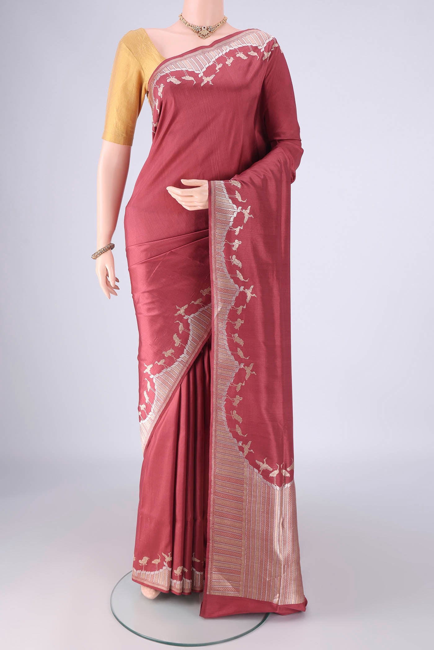 Mauve Banarasi Silk Saree with Plain Body and Zari Border.  displayed on a mannequin