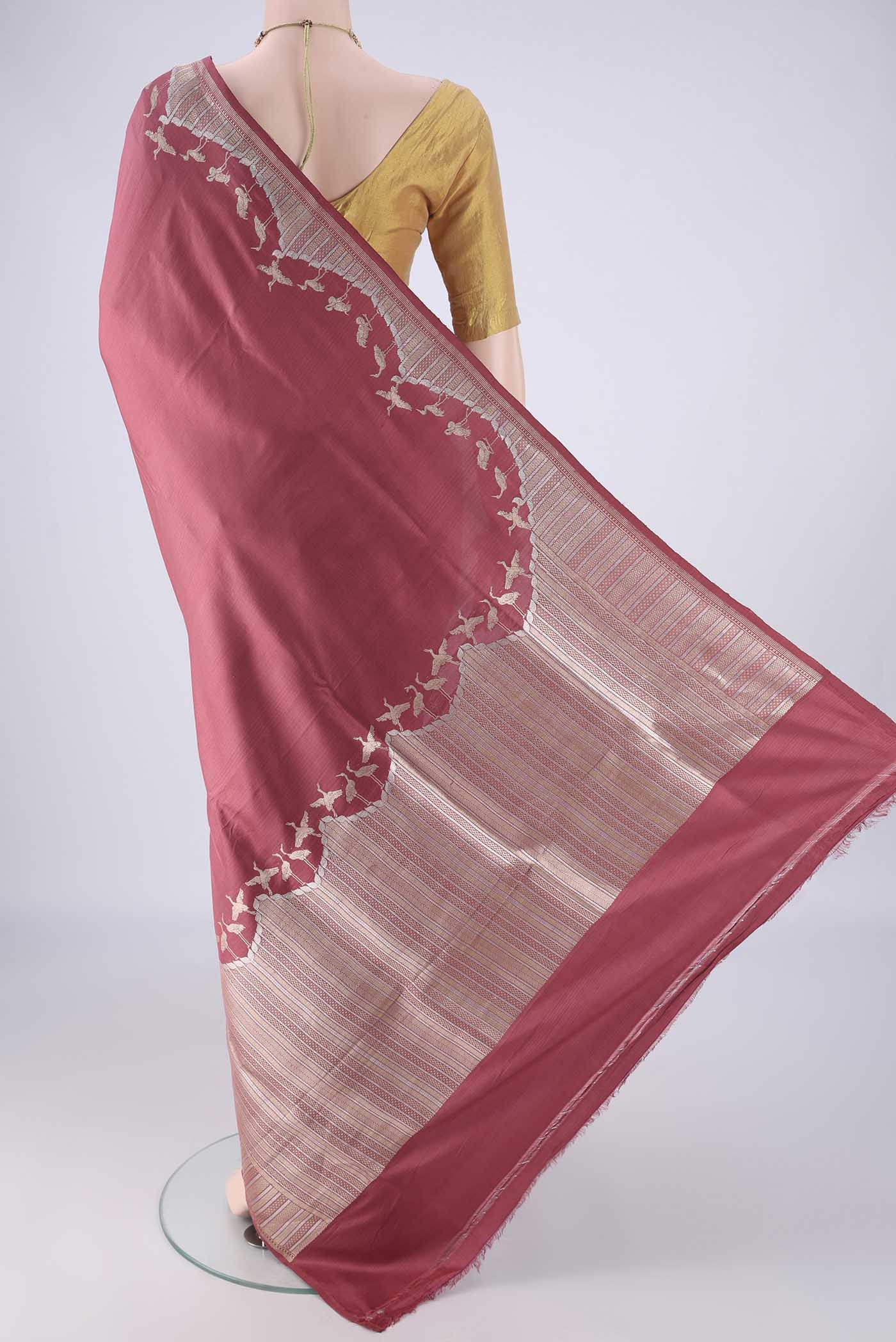 Flat view of Mauve Banarasi Silk Saree with Plain Body and Zari Border. 