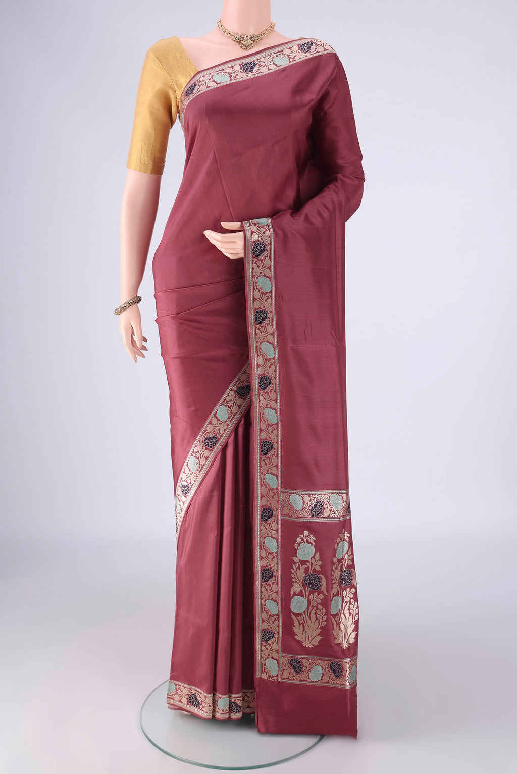 Mauve Banarasi Silk Saree with Plain Body and Meenakari Border.  displayed on a mannequin