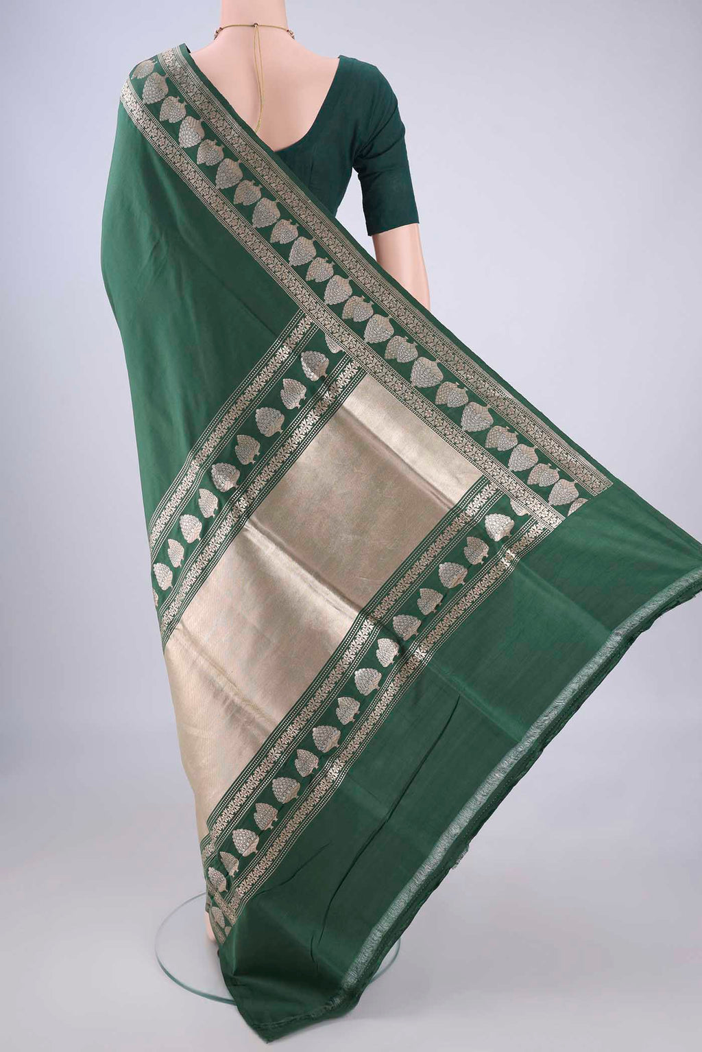 Flat view of Bottle Green Banarasi Silk Saree with Zari Butta on the body and Zari Border. 