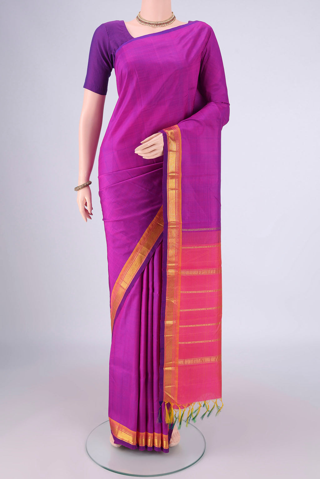 Magenta Dual Tone Kanjivaram Silk Saree with Plain Body and One Side Border.  displayed on a mannequin