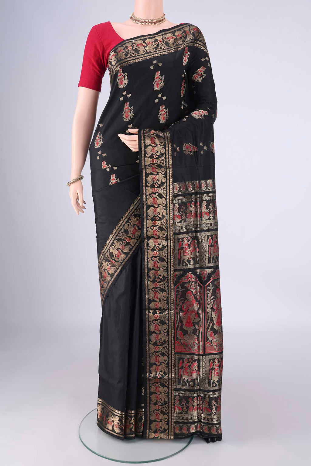 Black Baluchari Silk Saree with Zari And Thread Butta on the body and Zari Border.  displayed on a mannequin