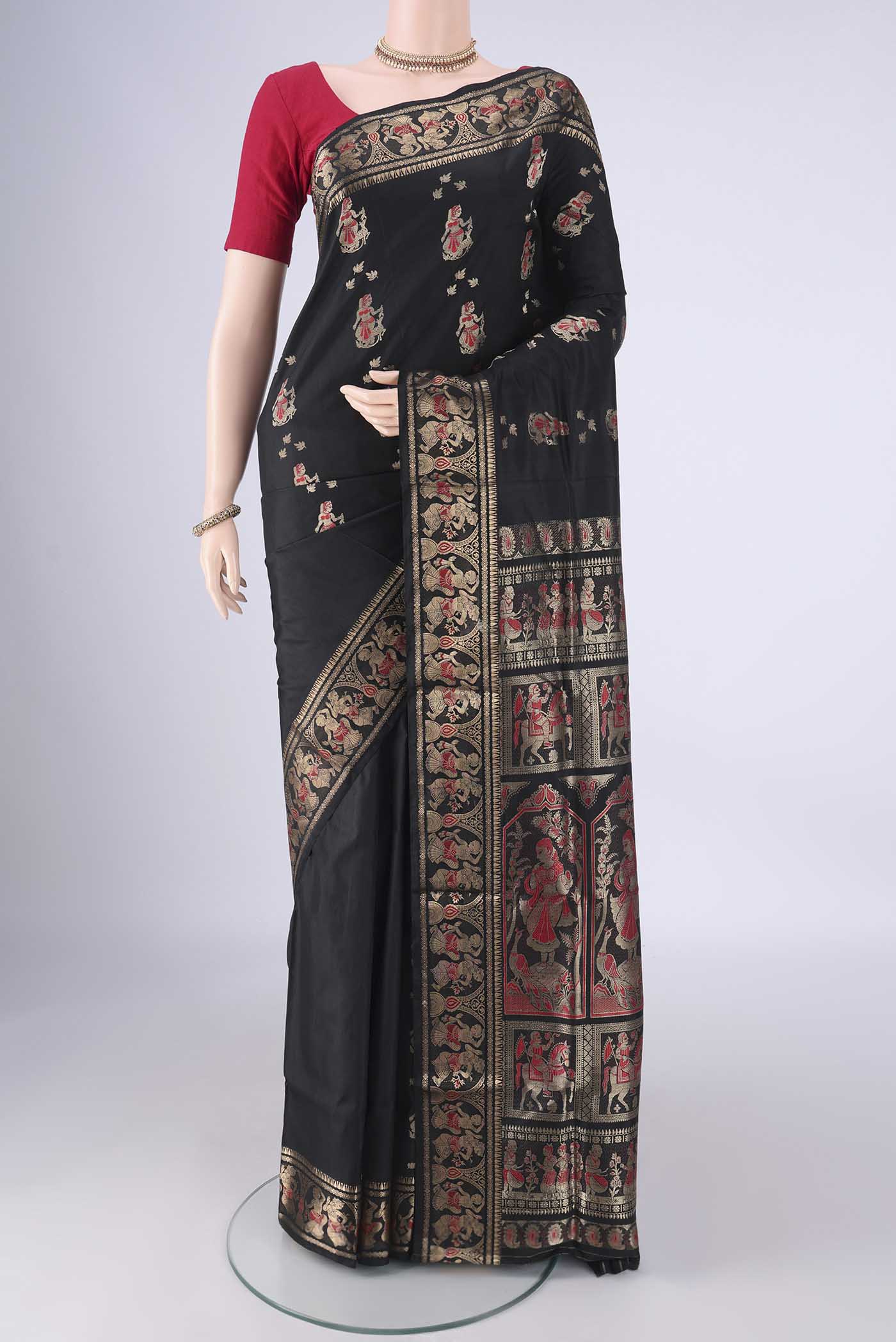 Black Baluchari Silk Saree with Zari And Thread Butta on the body and Zari Border.  displayed on a mannequin