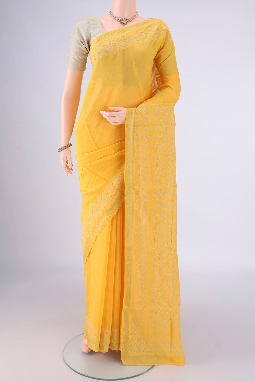 Yellow Chanderi Silk Cotton Saree with Plain Body and Fancy Border.  displayed on a mannequin