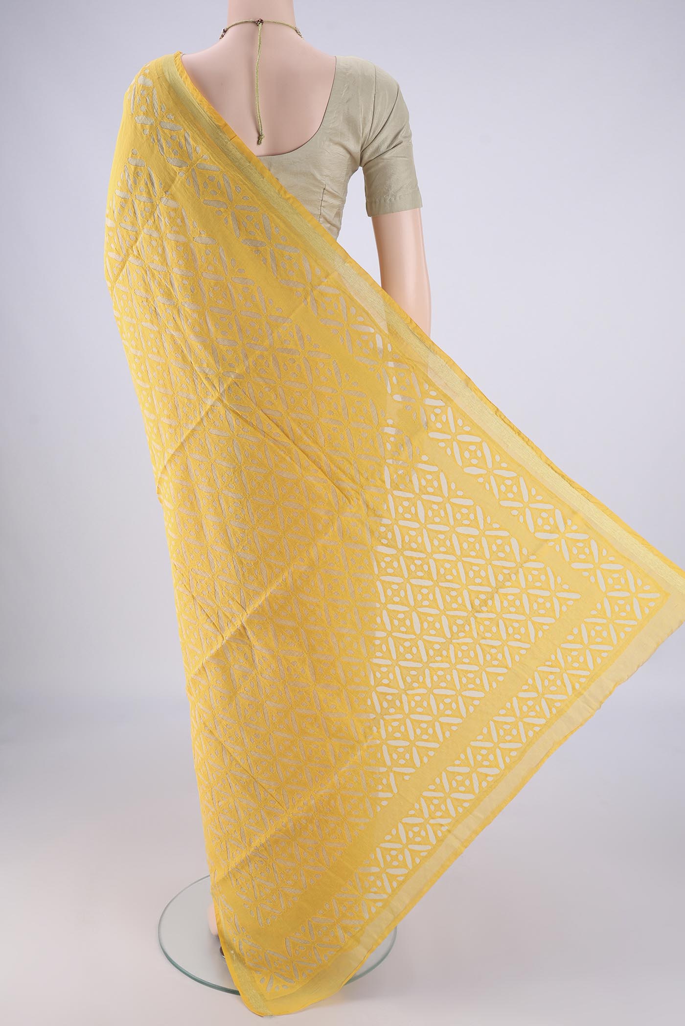 Flat view of Yellow Chanderi Silk Cotton Saree with Plain Body and Fancy Border. 