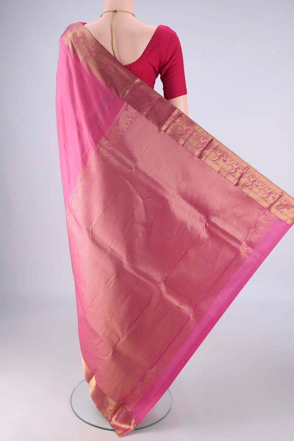 Flat view of Pink Kanjivaram Silk Saree with Plain Body and Zari Border. 