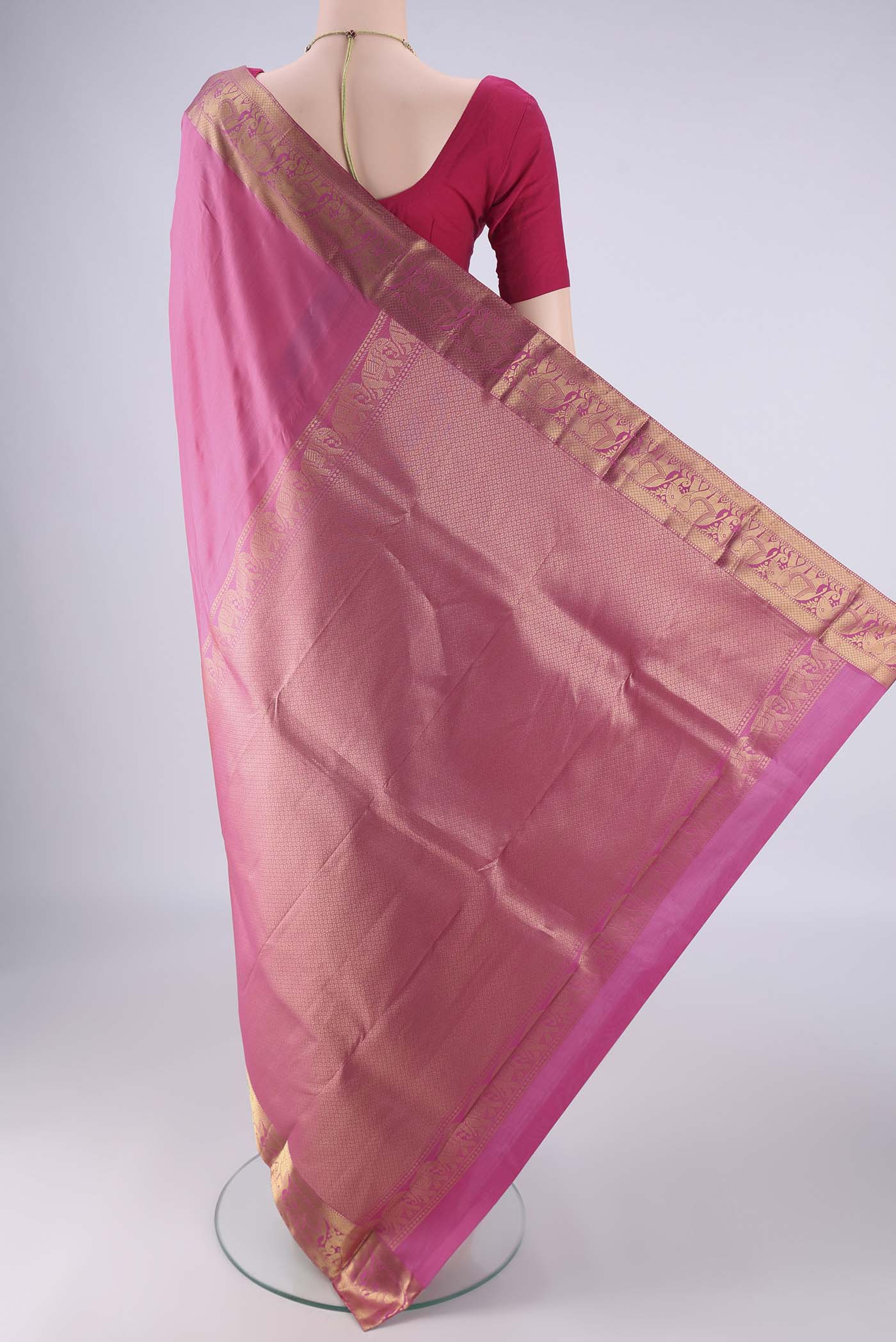 Flat view of Pink Kanjivaram Silk Saree with Plain Body and Zari Border. 