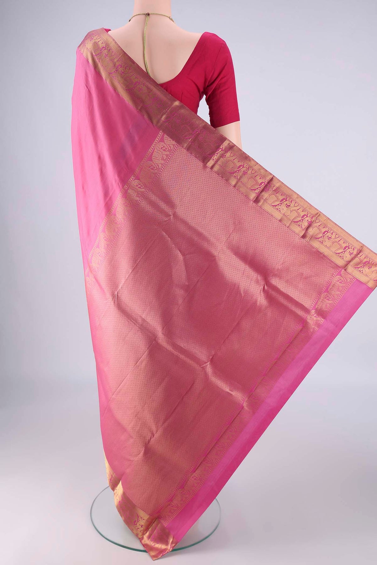 Flat view of Pink Kanjivaram Silk Saree with Plain Body and Zari Border. 