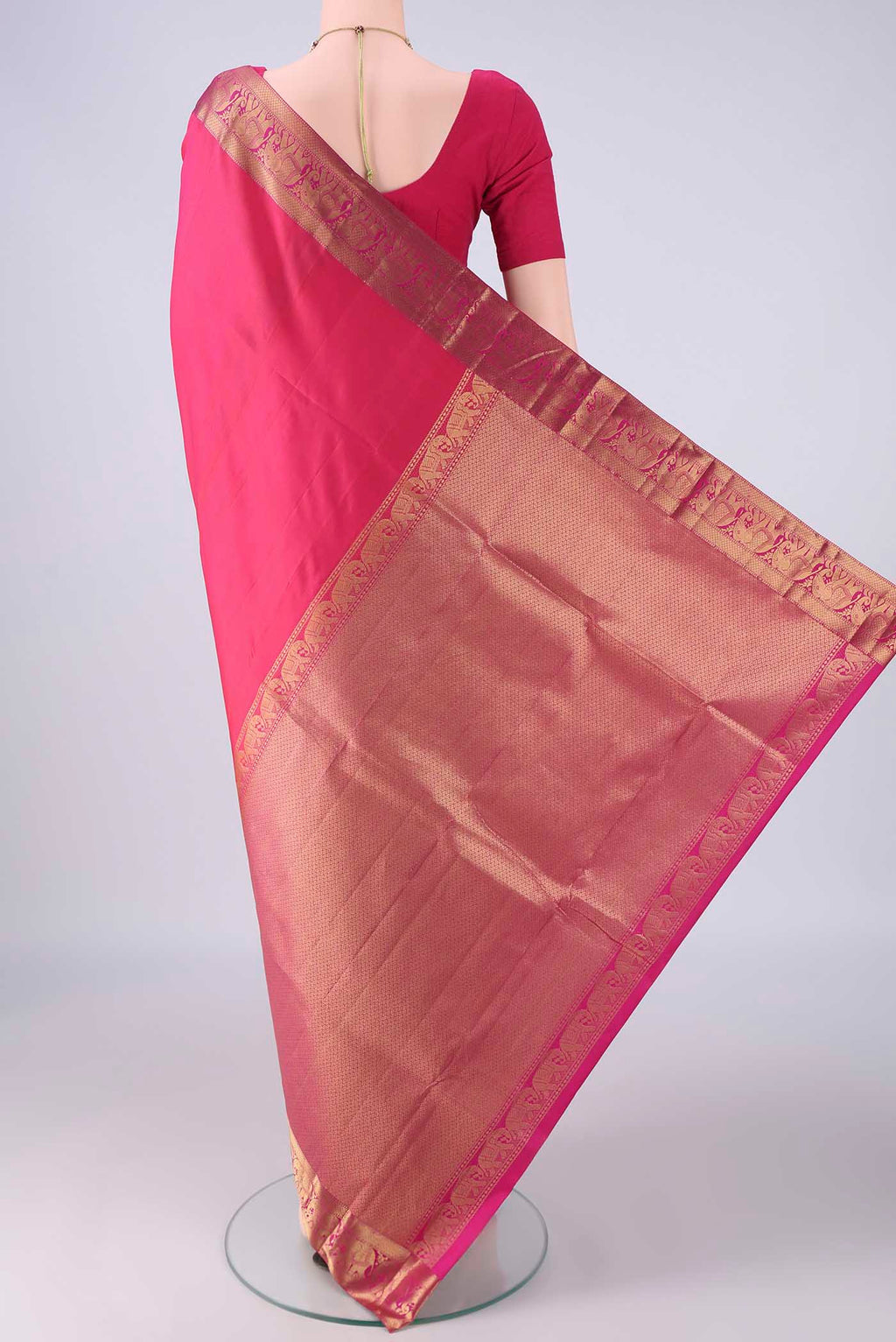 Flat view of Pink Kanjivaram Silk Saree with Plain Body and Zari Border. 