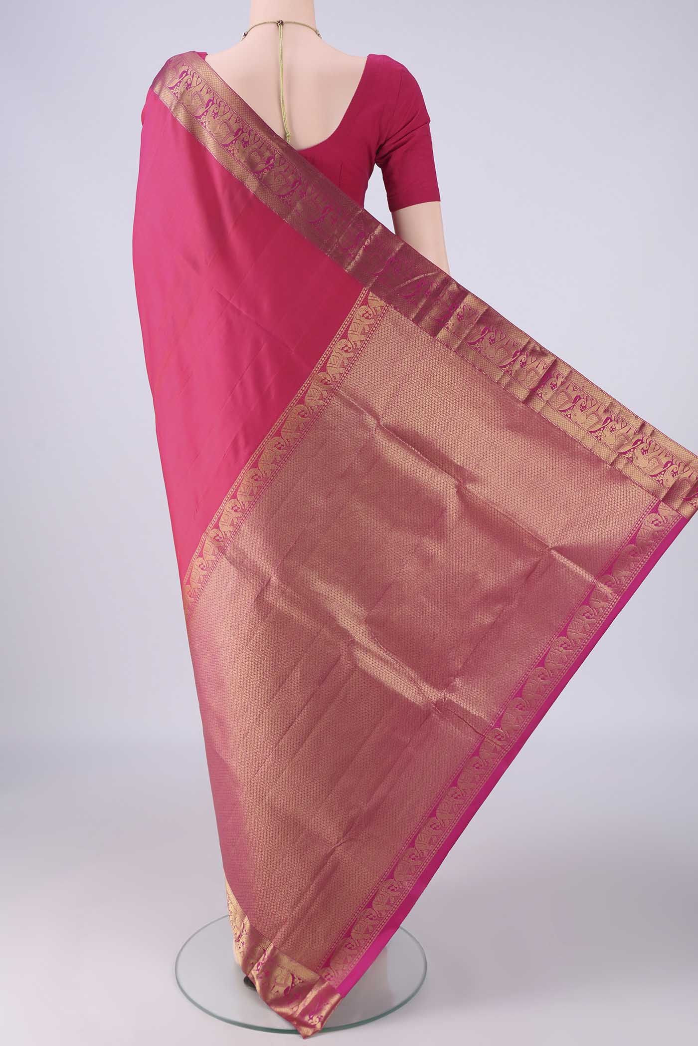 Flat view of Pink Kanjivaram Silk Saree with Plain Body and Zari Border. 