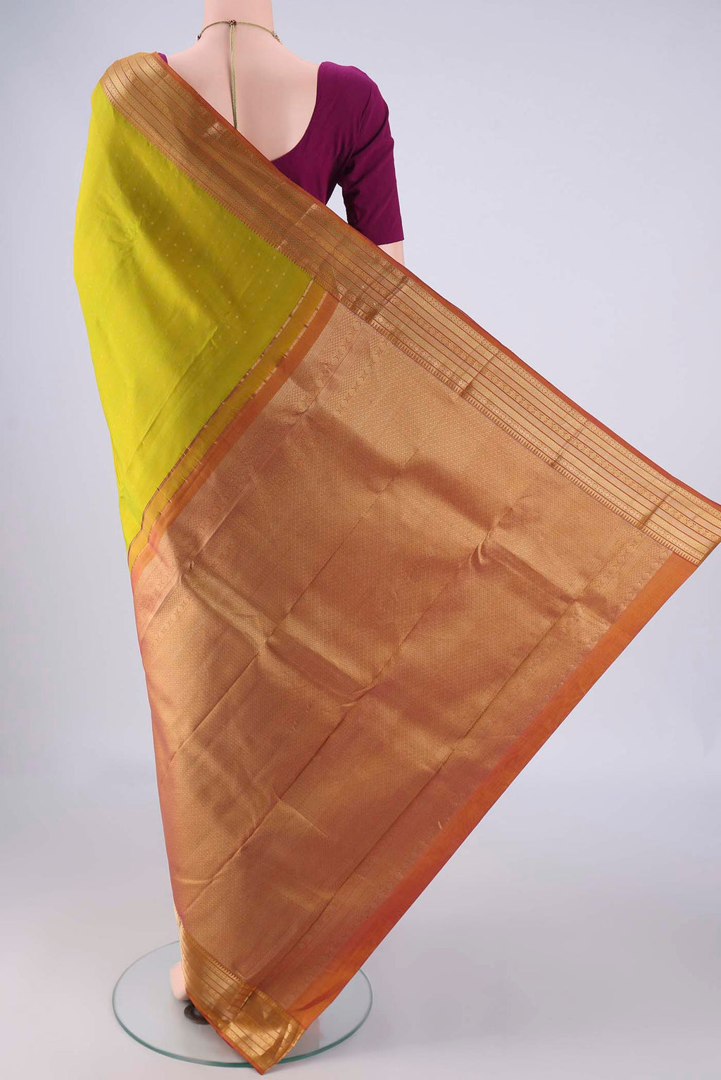 Flat view of Light Green Kanchipuram Silk Saree with Zari Butta on the body and Zari Border. 