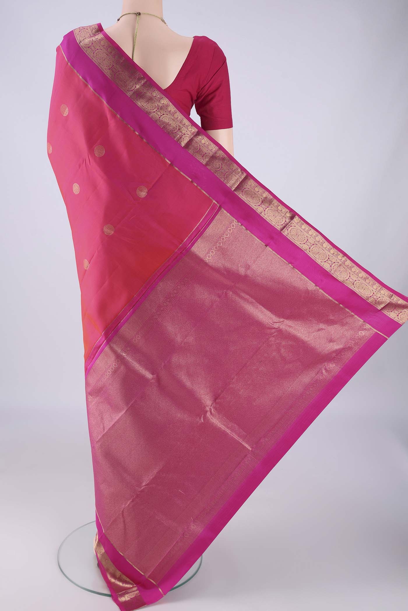 Flat view of Pink Kanchipuram Silk Saree with Zari Butta on the body and Zari Border. 