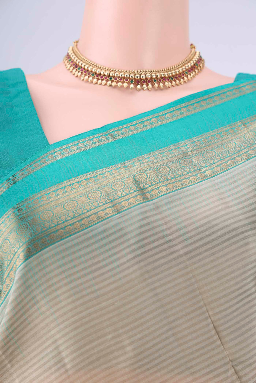Border image of Beige Kanchipuram Silk Saree with Stripes on the body and Zari Border. 